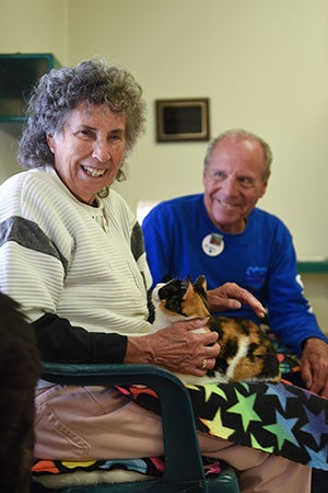 Marty and Brenda Winnick typically spend most of their time volunteering at Cat World, including some time with Ariel on Brenda's lap