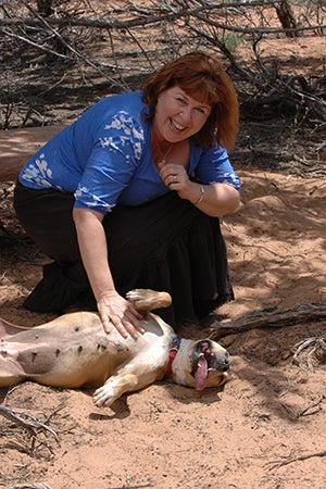 Volunteer and visitor director Patty Hegwood with Ellen the Vicktory dog