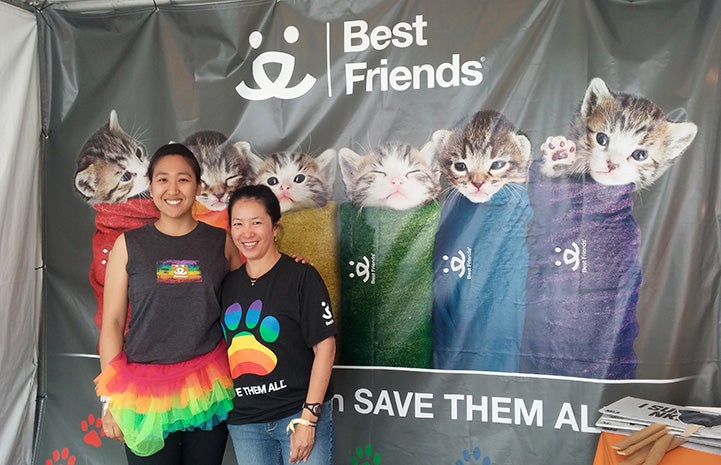 Volunteer Sophia Lim and another person standing by a Best Friends purritos sign Volunteer Sophia Lim and another person standing by a Best Friends purritos sign
