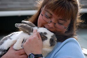 Bunny getting snuggles from a woman