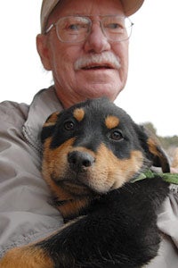 Don Bain holding a puppy Don Bain holding a puppy