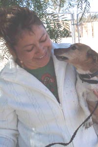 C.A.R.E. (Cat & Canine Assistance, Referral and Education) caregiver holding a dog C.A.R.E. (Cat & Canine Assistance, Referral and Education) caregiver holding a dog