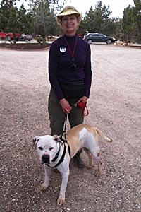 Sue Haynes walking a dog at Best Friends Animal Sanctuary