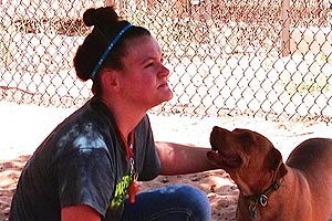 Maren, a member of a church youth group volunteering at Best Friends Animal Sanctuary, and Lakota the dog