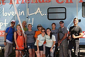 Volunteers in front of mobile animal adoption van