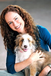 Elizabeth Oreck, national manager of Best Friends’ puppy mill initiatives, holding a dog