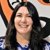 Michelle Dosson standing in front of a colorful background
