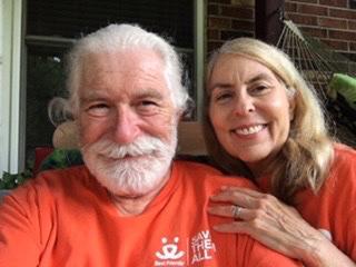Bob and Penny Burleson wearing orange Best Friends volunteer T-shirts
