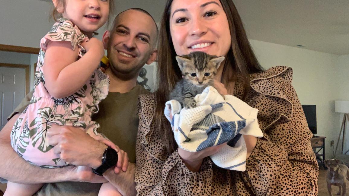Baby Scout the kitten with her new family