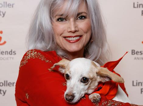 Emmylou Harris and white dog at Best Friends Lint Roller Party