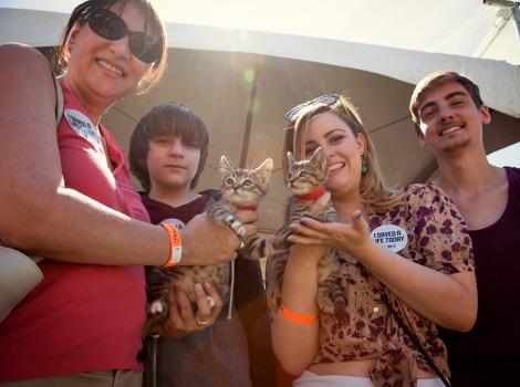 Family holding kittens they adopted